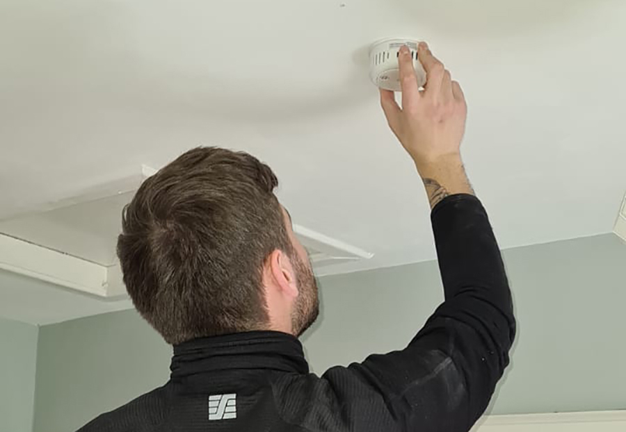 Electrician in Edinburgh carrying out Smoke Alarm Installation.